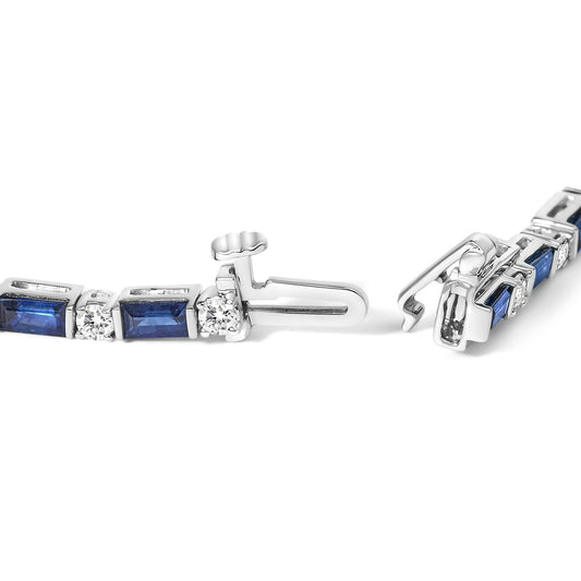Close-up side angle of a white bracelet with alternating blue rectangular gemstones in channel settings and round white gemstones in prong settings, featuring an open clasp.
