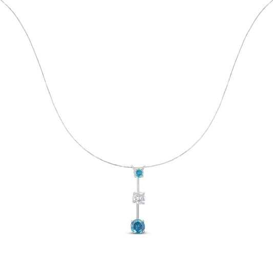 Front view of a white metal necklace with a vertical pendant featuring one white round gemstone between two blue round gemstones, all in prong settings.
