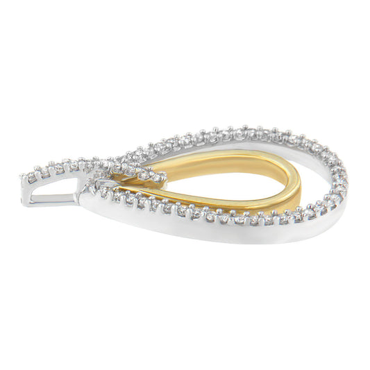 Close-up side angle of a two-toned teardrop-shaped necklace pendant featuring a white outer layer with round white gemstones in prong settings and a smooth gold-toned inner loop.