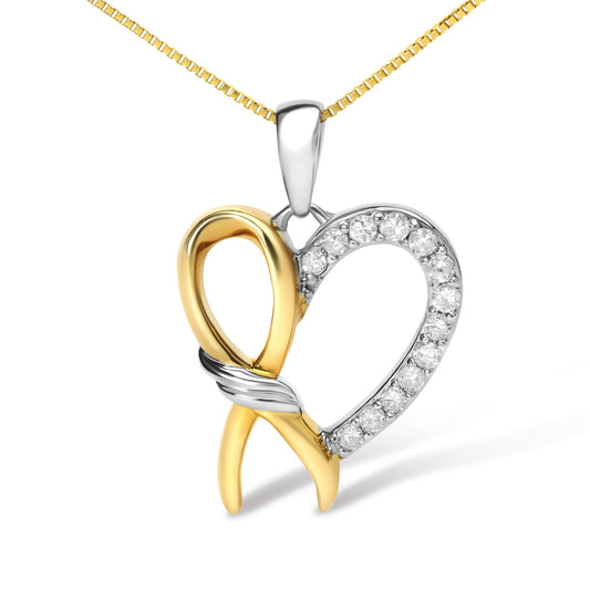 Close-up front angle of a two-tone heart-shaped necklace pendant with round white gemstones set along one side and a mixed metal ribbon design crossing at the center, hanging from a yellow chain.