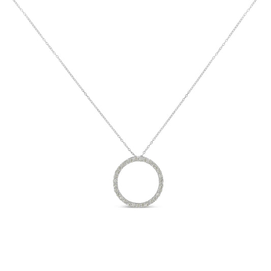 Front-facing shot of a white metal necklace with a circular pendant encrusted with round white gemstones in a pave setting.
