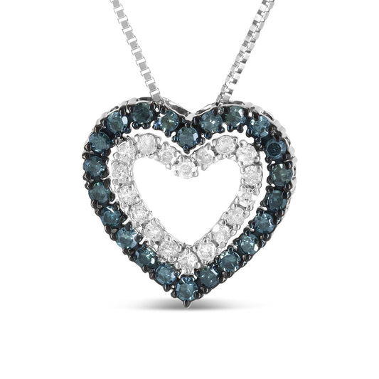 Front-facing view of a white metal heart-shaped pendant necklace featuring two rows of round prong-set gemstones, with an outer row of blue gemstones and an inner row of white gemstones.