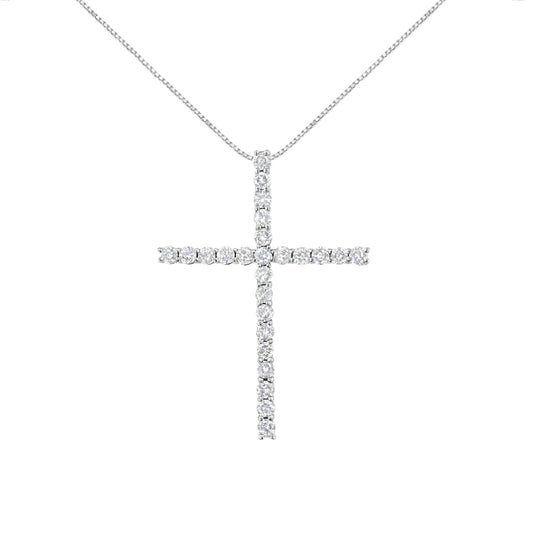 Front view of a white metal cross-shaped necklace pendant set with round white gemstones in prong settings hanging on a white metal chain.