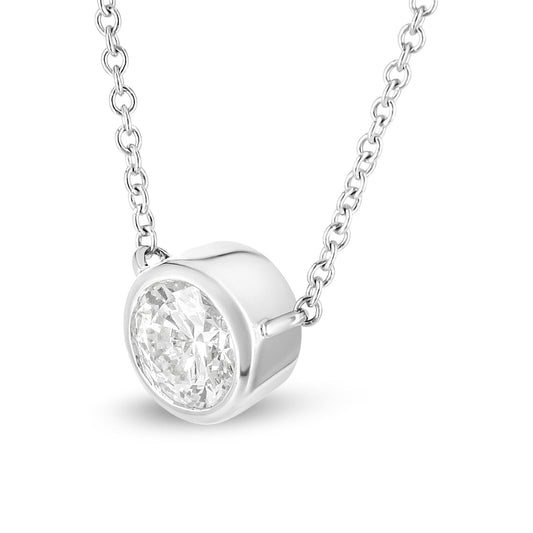 Close-up front angle of a white metal necklace with a round white gemstone in a bezel setting.