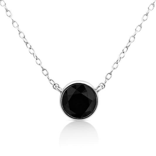 Close-up front view of a white necklace with a round black gemstone in a bezel setting.
