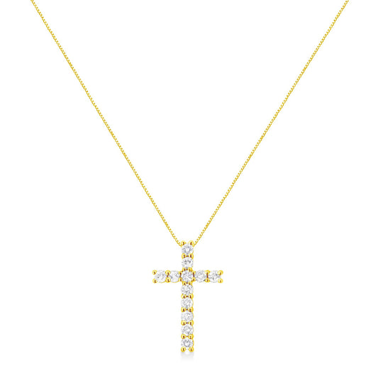 Front-facing view of a yellow metal cross-shaped necklace pendant with round prong-set white gemstones on a thin chain.