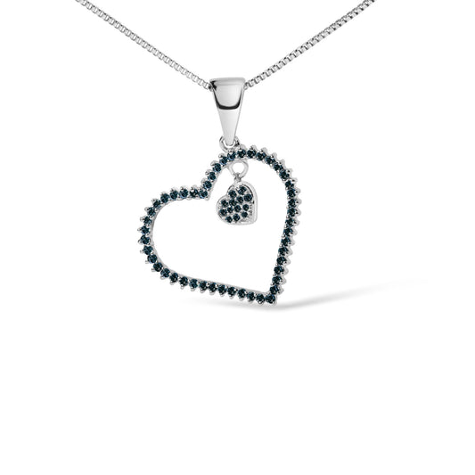 Close-up front angle of a white metal necklace with a heart-shaped pendant outlined with round blue gemstones in prong settings and a smaller heart charm inside also adorned with blue gemstones.