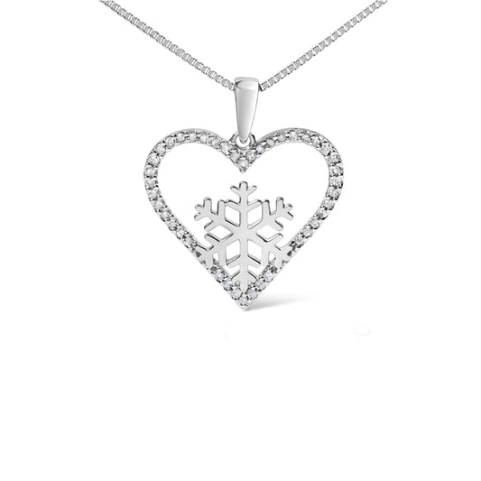 Close-up front angle of a white metal heart-shaped necklace pendant adorned with round white gemstones in prong settings around the outline, featuring a snowflake design in the center, shown on a white background.