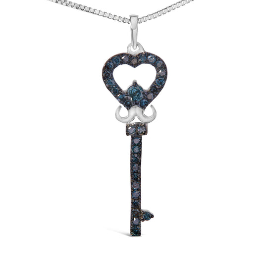 Front-facing shot of a white metal key-shaped necklace pendant adorned with round blue gemstones in prong settings, featuring a heart-shaped top and a vertical shaft below.