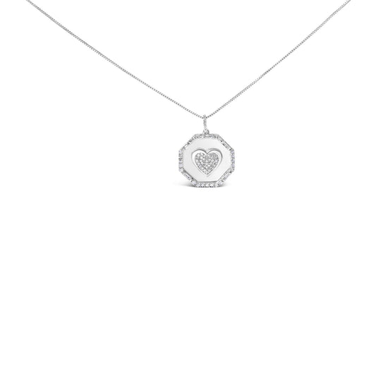 Front-facing shot of a white metal necklace with a pendant featuring a heart-shaped center of round white gemstones surrounded by an octagonal frame studded with round and baguette white gemstones.