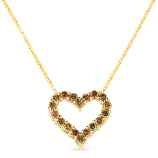Front angled view of a yellow metal necklace with a heart-shaped pendant outlined with round brownish gemstones in prong settings.