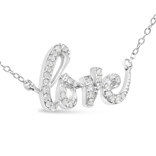 Close-up angled view of a white metal necklace pendant spelling 'love' adorned with round white gemstones in prong settings.