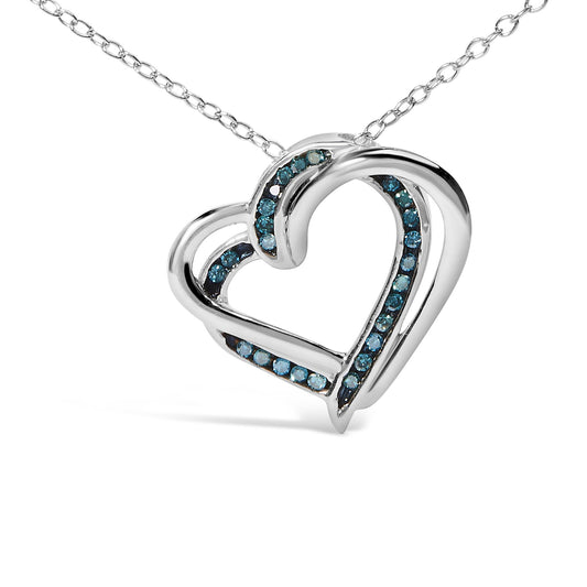 Close-up front angle of a white metal heart-shaped necklace pendant with round blue gemstones set in a channel along the inner curves.