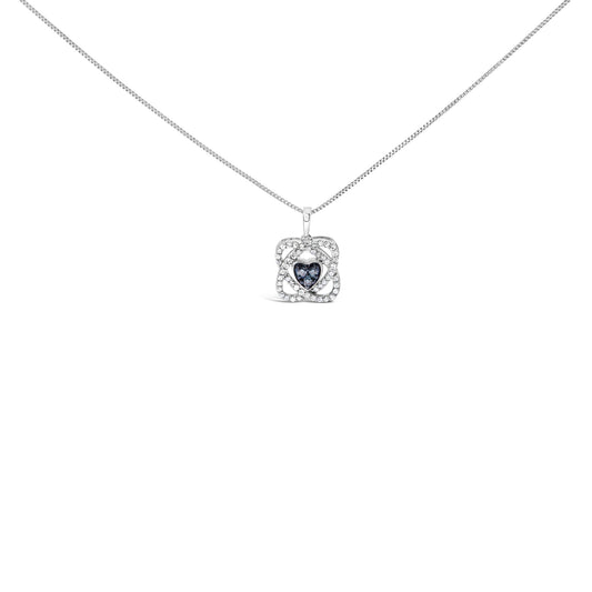 Front angle view of a white metal necklace with a pendant featuring a heart-shaped cluster of blue gemstones surrounded by a square frame of white round gemstones.