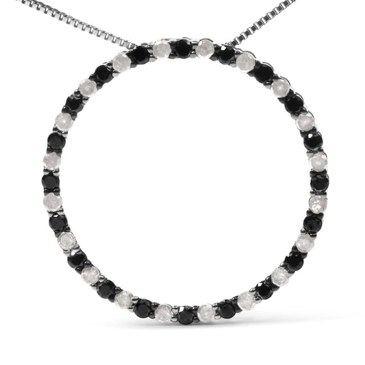Front view of a white necklace with alternating round black and white gemstones in prong settings forming a circular pendant.