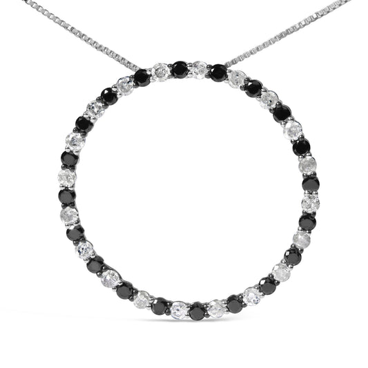 Close-up front view of a white necklace featuring a circle pendant adorned with alternating round black and white gemstones in prong settings.