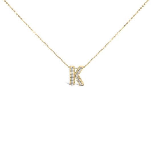 Close-up front angle of a yellow metal necklace with a pendant shaped like the letter K, adorned with round white gemstones in a prong setting on the pendant's front surface.