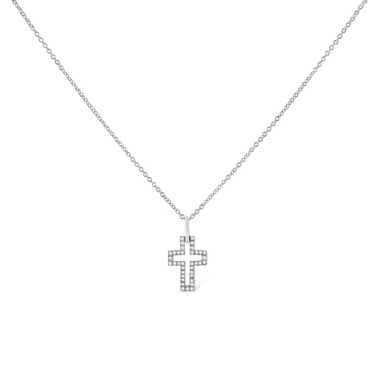 Front-facing shot of a white metal necklace with a cross-shaped pendant outlined with round white gemstones in a pave setting.
