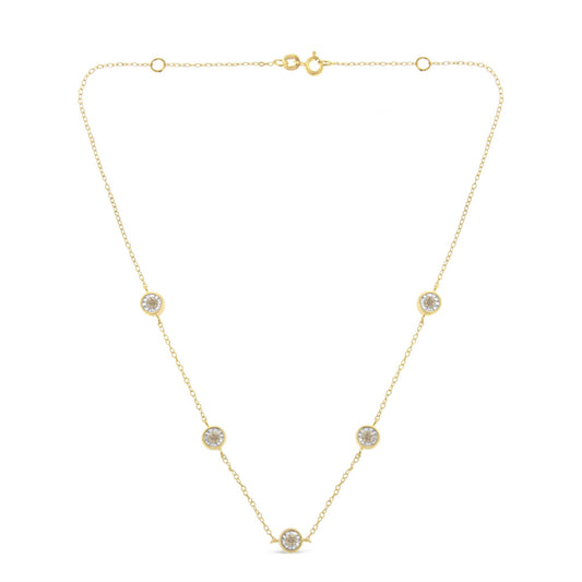 Front view of a yellow metal necklace with round brownish gemstones in miracle settings evenly spaced along a delicate chain.