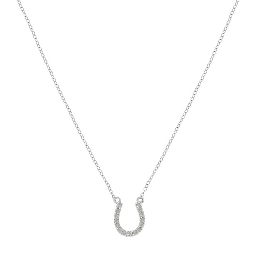 Front-facing shot of a white metal necklace with a horseshoe-shaped pendant embellished with round white gemstones in prong settings.