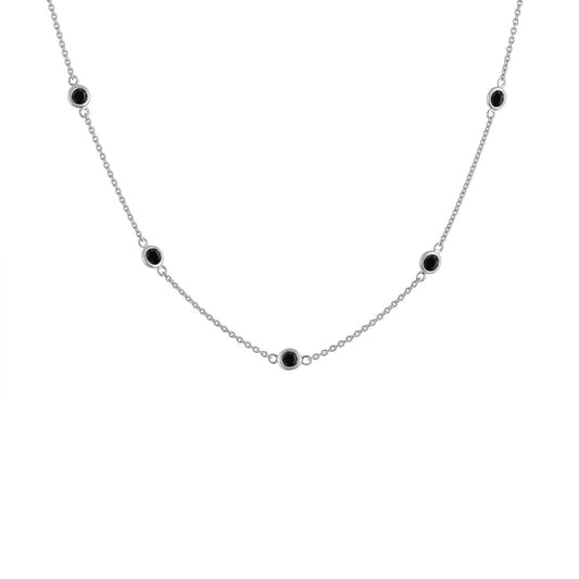 White metal necklace with round black gemstones in bezel settings evenly spaced along the chain, shown in a front-facing angle.