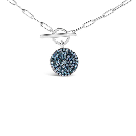 White metal necklace with a round pendant encrusted with multiple blue gemstones, shown in a front-facing close-up shot.