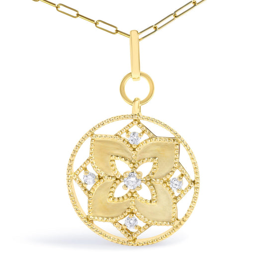 Close-up front view of a yellow metal necklace featuring a circular pendant with intricate floral cut-out design accented by five white round gemstones in prong settings. The pendant hangs from a chain with elongated oval links.