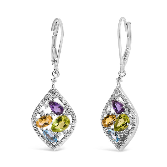 Pair of white metal drop earrings shown in a front-facing close-up. Each earring features a kite-shaped frame adorned with small white gemstones set around the edges, enclosing four colored gemstones in purple, green, yellow, and blue in varied shapes. The earrings have lever-back clasps and are positioned side by side against a white background.