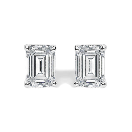 Close-up front view of a pair of white metal stud earrings featuring emerald-shaped white gemstones in 4-prong settings.