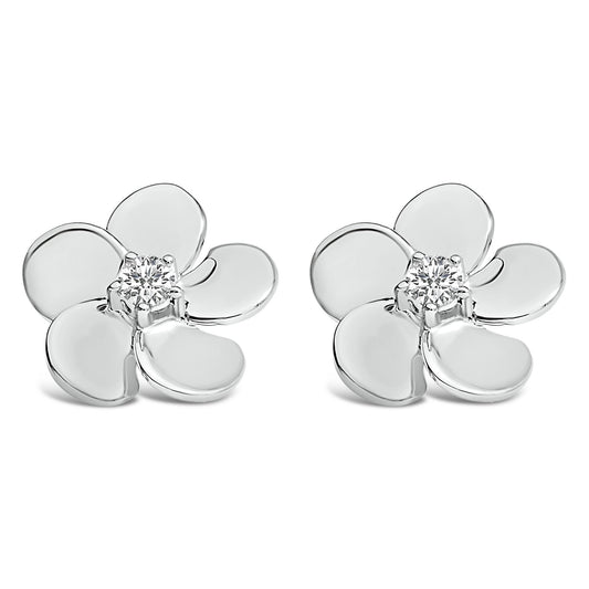 Pair of white metal flower-shaped earrings with round white gemstones in prong settings at the center, shown from a front angle on a white background.
