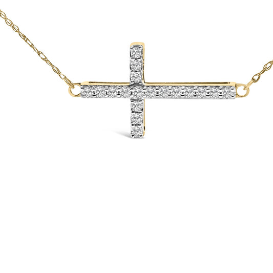 Front-facing close-up of a yellow metal cross necklace adorned with round white gemstones in a shared prong setting.