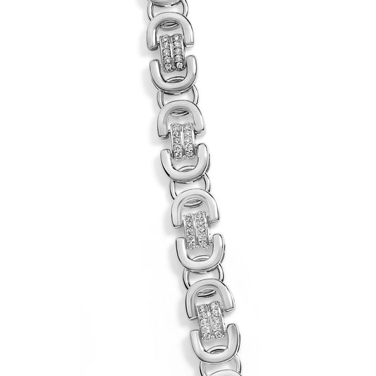 Close-up top-down view of a white metal necklace featuring alternating open D-shaped links and vertical bars studded with round white gemstones in prong settings.