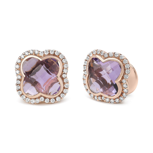 Pair of rose-colored earrings with rounded four-leaf clover-shaped purple gemstones in the center, surrounded by a halo of small round white gemstones, shown from a front angle.
