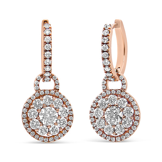 Front-facing close-up of a pair of rose-colored metal earrings with round white gemstones in prong settings arranged in circular clusters, photographed on a white background.