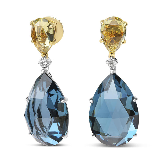 Front-facing view of drop earrings featuring yellow pear-shaped gemstones at the top, small round white gemstones beneath, and large blue pear-shaped gemstones hanging below, set in yellow and white metal.