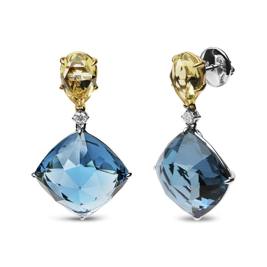 Front and side view of drop earrings with yellow pear-shaped gemstones at the top, small round white gemstones below, and large blue cushion-shaped gemstones at the bottom, set in yellow and white metal.