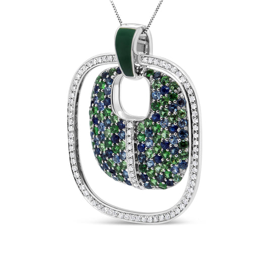 Close-up front angle of a white necklace pendant featuring an open square frame paved with white gemstones, with an inner curved square piece adorned with blue and green gemstones, and a small green enamel detail on the bail.