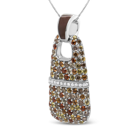 Close-up front angled view of a white metal necklace pendant featuring a trapezoid shape with an open center near the top, adorned with round red, yellow, and brown gemstones and a horizontal row of white gemstones across the middle.