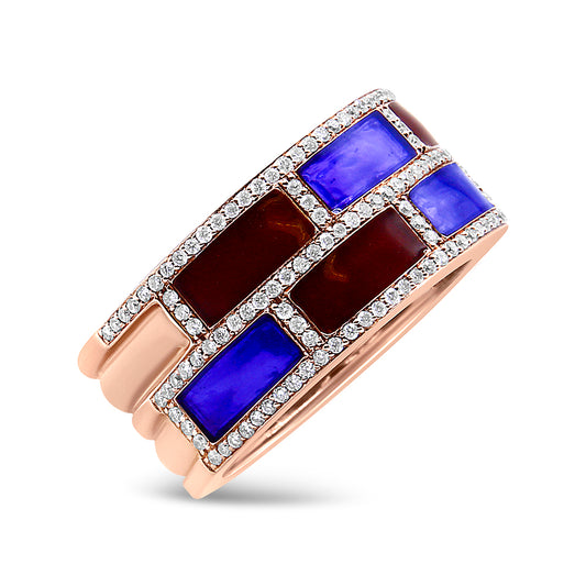 Rose metal ring with alternating rectangular blue and dark red gemstones, bordered by rows of small white gemstones, shown at an angled close-up.
