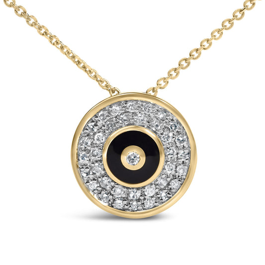 Close-up front angle of a yellow metal necklace with a circular pendant, featuring a center black circle outlined with a round white gemstone in bezel setting, surrounded by numerous small round white gemstones in prong settings, shown on a white background.