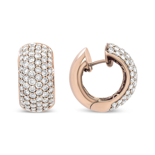 Close-up front and angled side view of a pair of rose metal hoop earrings with multiple white round gemstones set in prongs.
