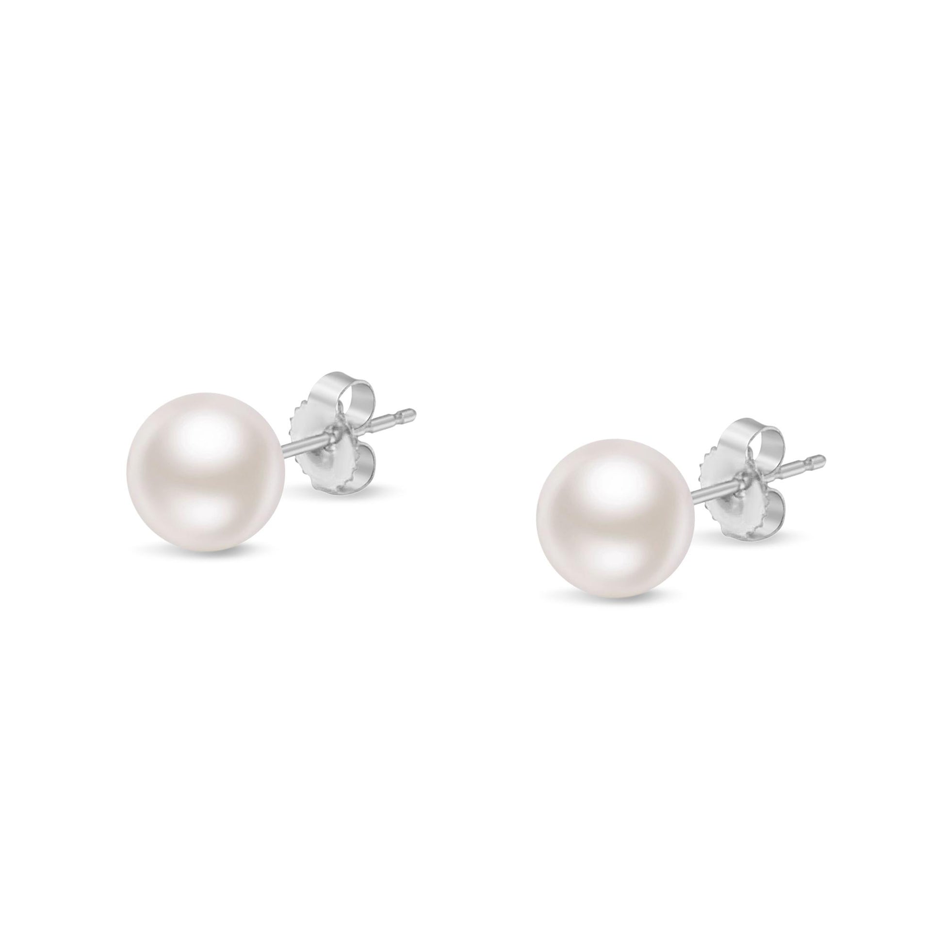 Pair of white metal stud earrings with round white gemstone fronts, shown from a front angle.
