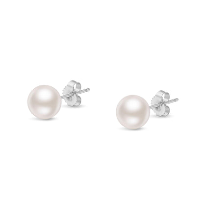 Pair of white metal stud earrings with round white gemstone fronts, shown from a front angle.