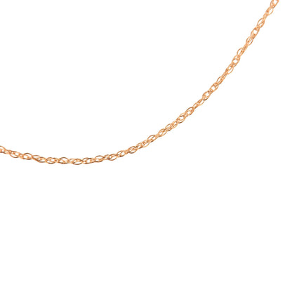 Close-up angle of a delicate rose-colored chain with small intertwined links on a white background.