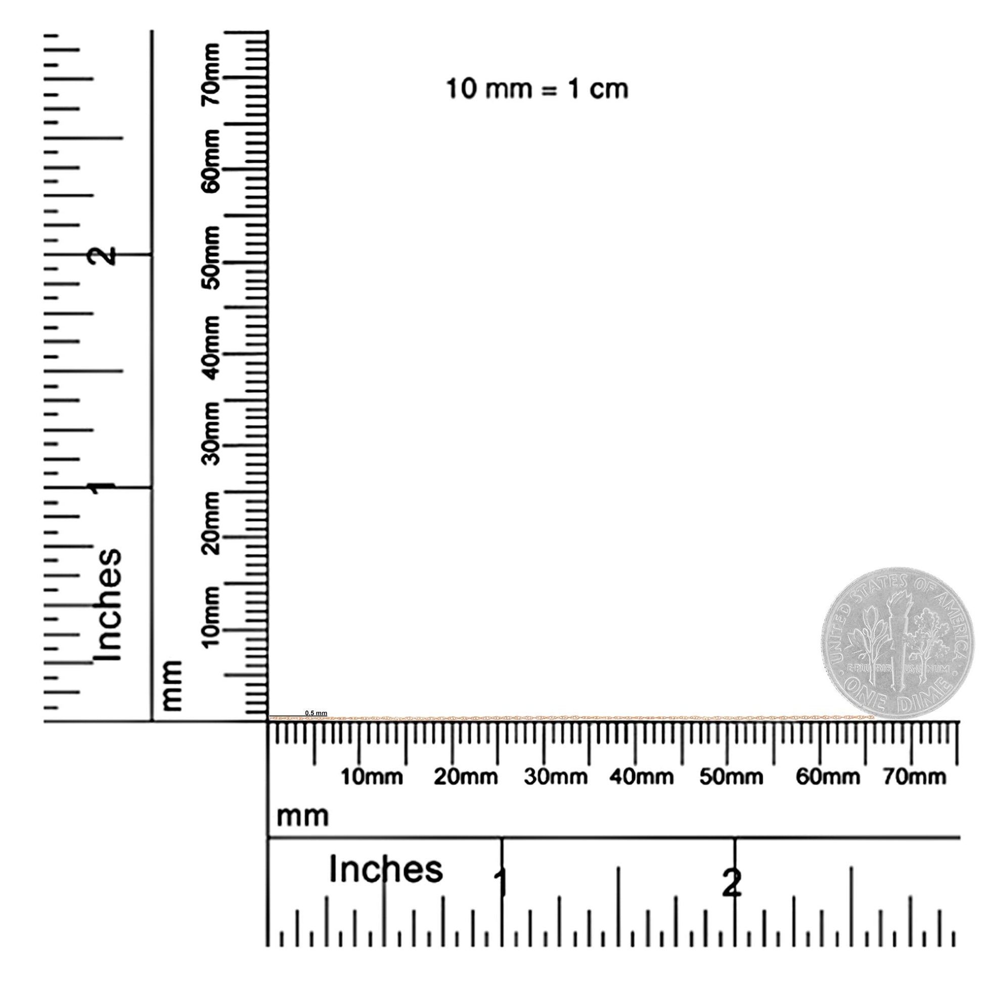 Close-up shot of a thin rose metal chain placed horizontally on a ruler and scale for size reference.