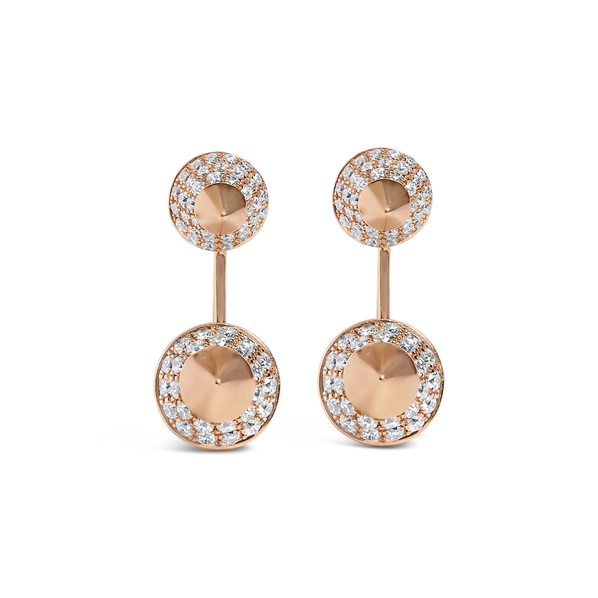 Front view of rose metal drop earrings with two circular elements each, featuring white round pave set gemstones surrounding a smooth center.