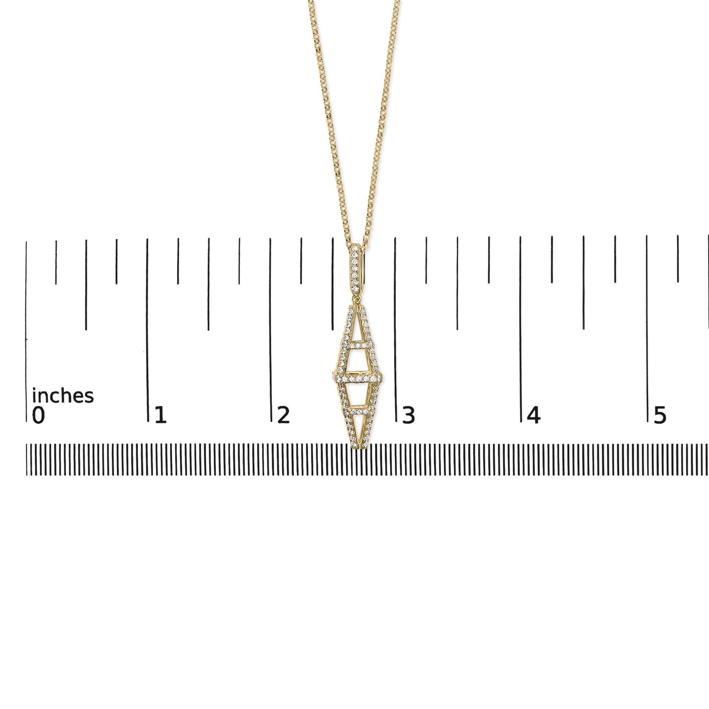 Yellow metal necklace with elongated geometric pendant featuring round white gemstones in pave setting, shown from front angle on ruler for size reference.