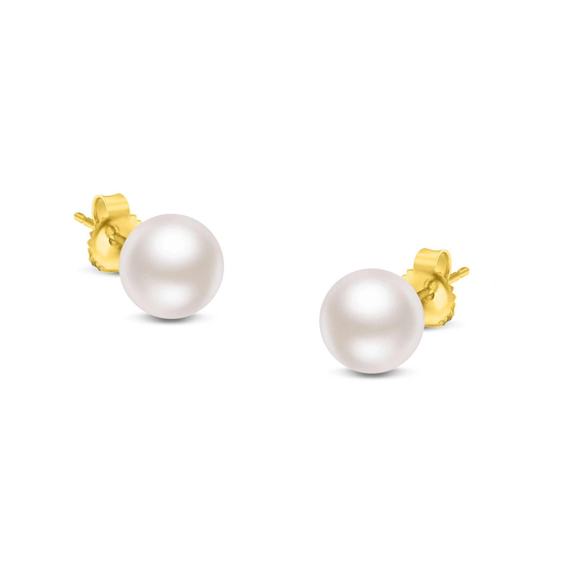 Pair of yellow metal stud earrings with round white gemstone pearls, shown from a front close-up angle.