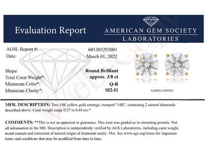Pair of yellow metal stud earrings with round white gemstones in 4-prong settings, shown from a front angle.