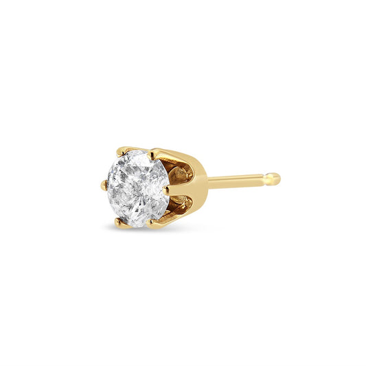 Close-up side view of a yellow metal stud earring with a round white gemstone in a six-prong setting.